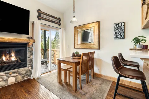 a livingroom with furniture a flat screen tv and a fireplace