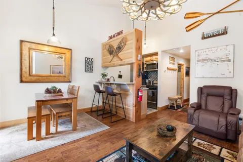 a view of a workspace with furniture and a workspace