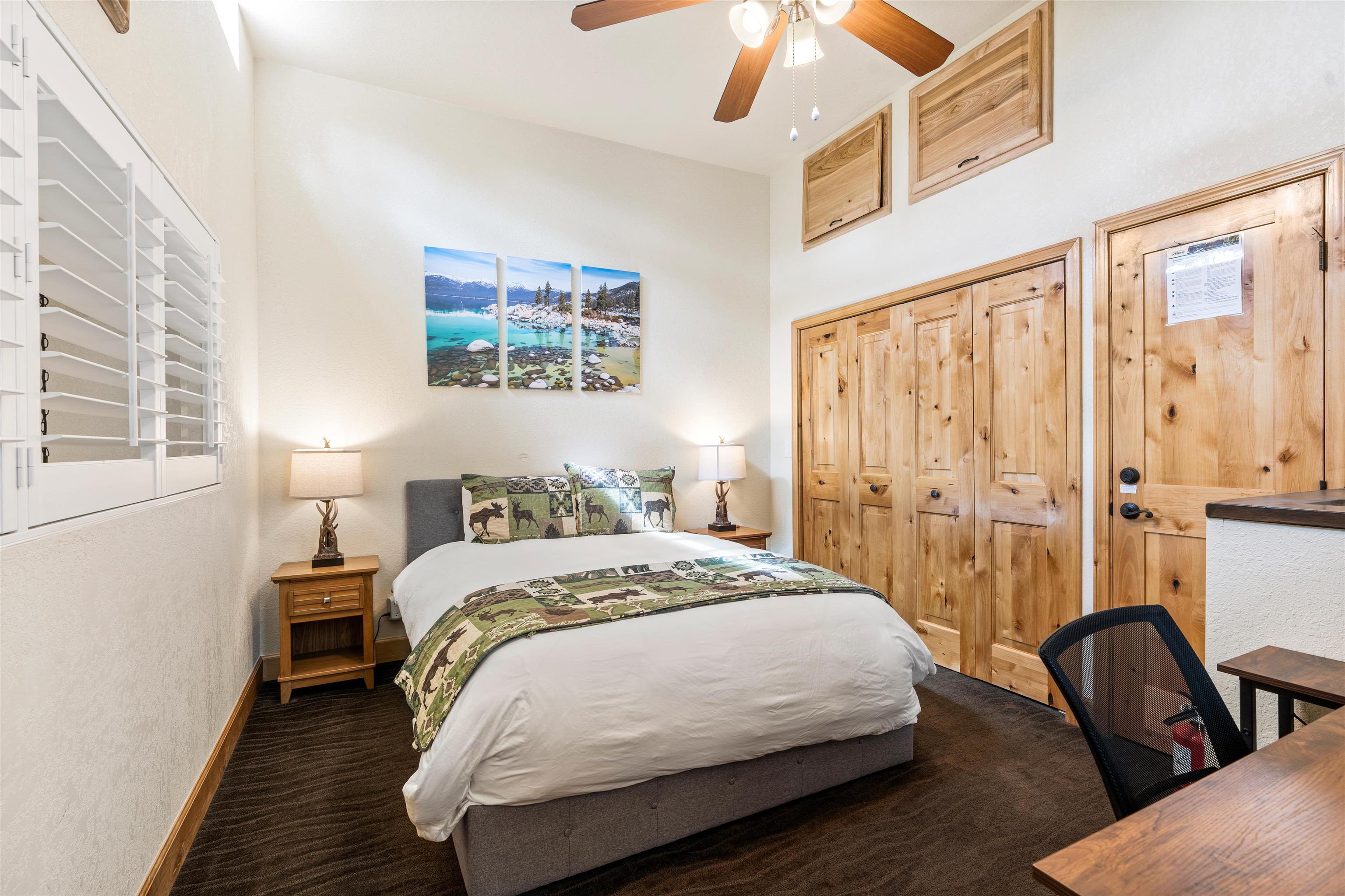 1300 Regency Way, Unit 37 Tahoe Vista, CA 96148 - Photo 10 of 27 a bedroom with a bed and wooden floor