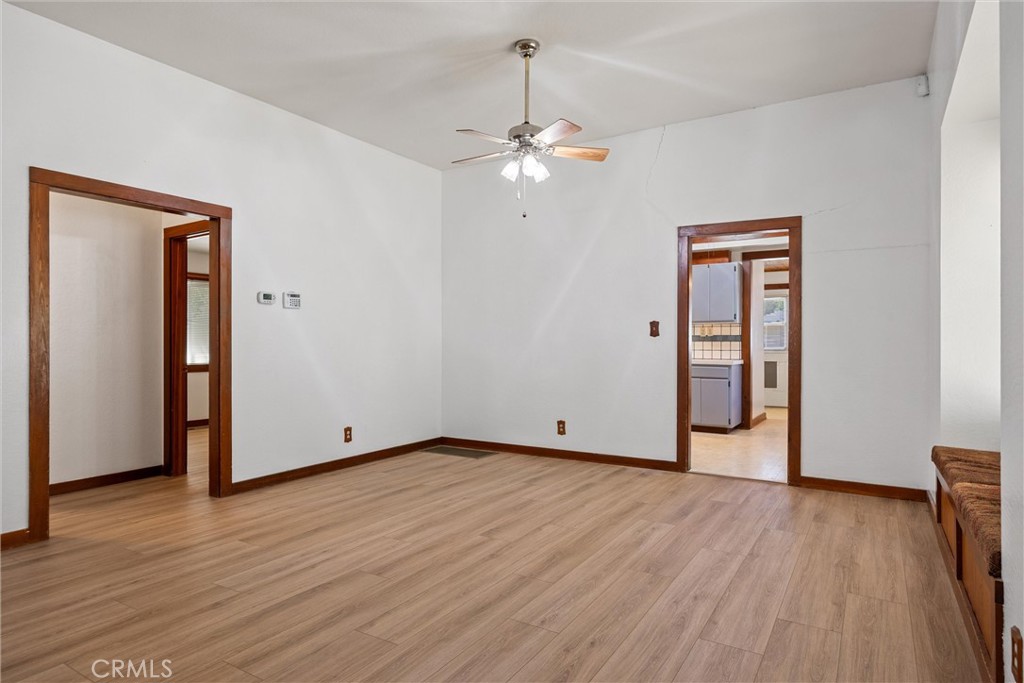 529 South Shasta Street Willows, CA 95988 - Photo 11 of 29 a view of an empty room with wooden floor and a ceiling fan