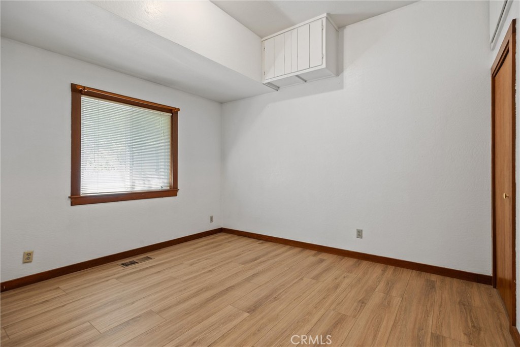 529 South Shasta Street Willows, CA 95988 - Photo 20 of 29 a view of an empty room with wooden floor and a window