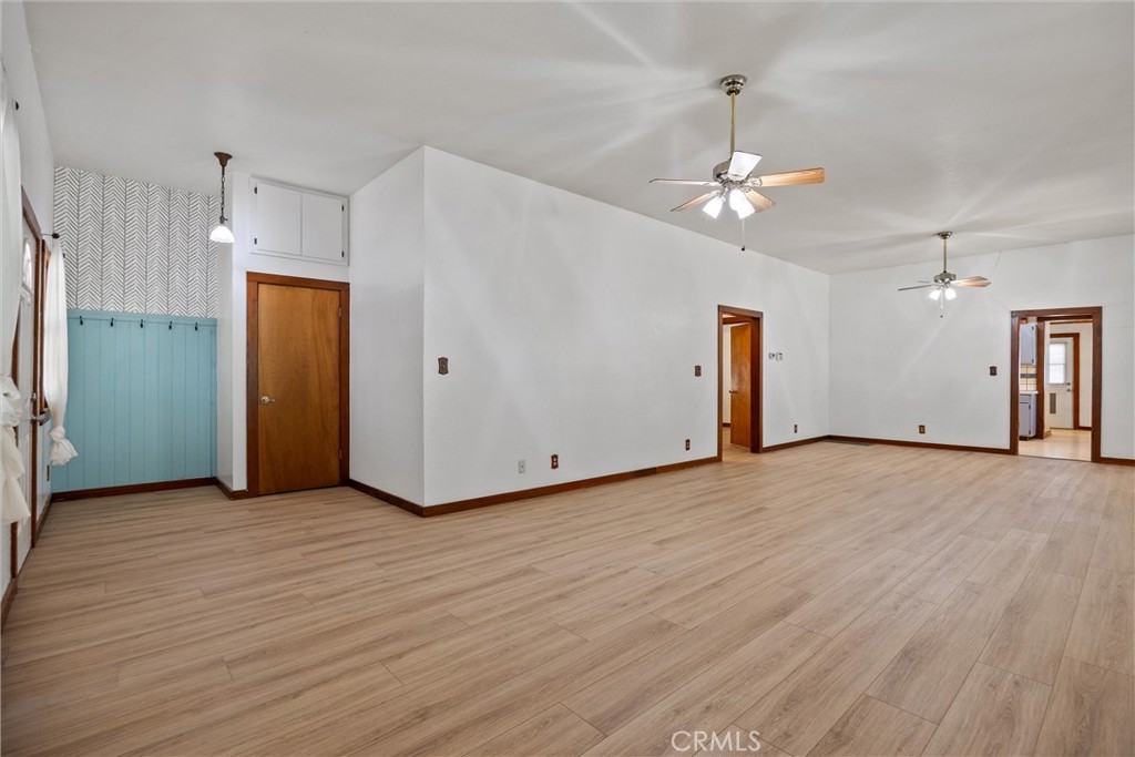 529 South Shasta Street Willows, CA 95988 - Photo 7 of 29 an empty room with wooden floor and a ceiling fan