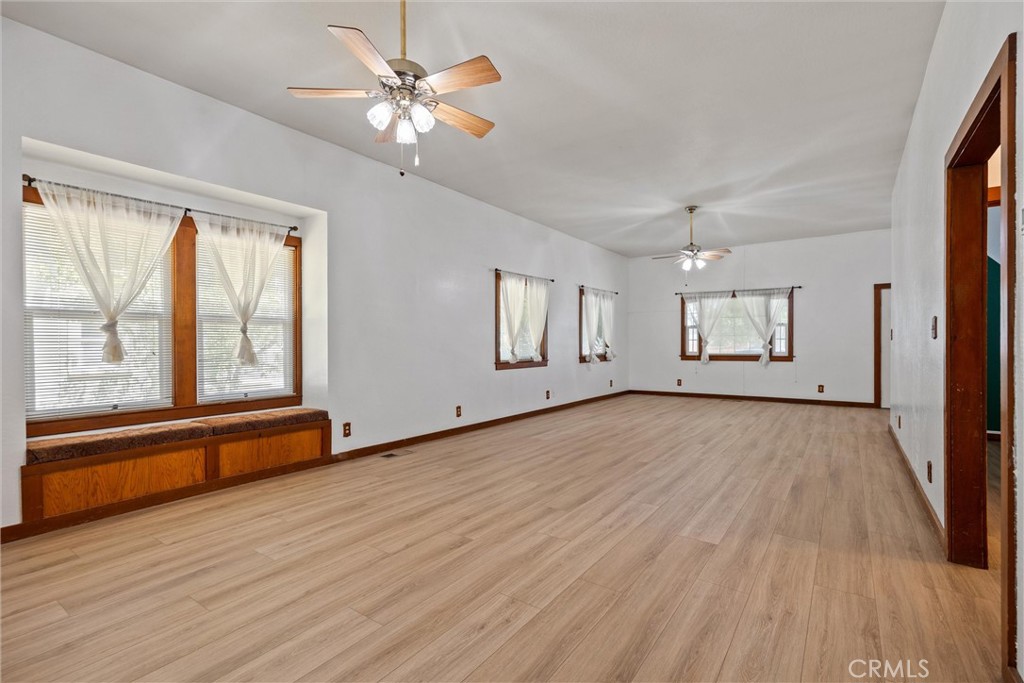 529 South Shasta Street Willows, CA 95988 - Photo 10 of 29 a view of an empty room with a window and wooden floor