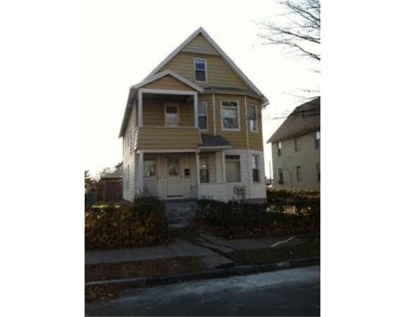 71-73 Cleveland Street Springfield, MA 01104 - Photo 1 of 1 a front view of a house with a yard
