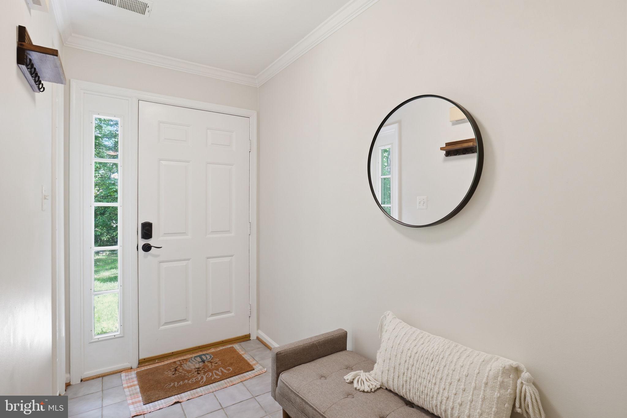 1495 Church Hill Place Reston, VA 20194 - Photo 2 of 27 a view of a livingroom with furniture and a mirror