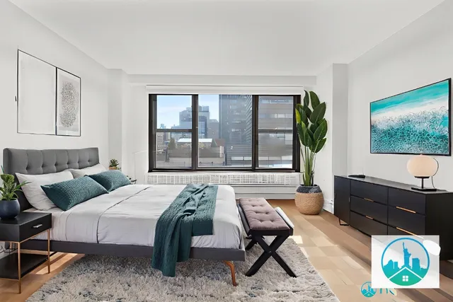 a living room with furniture lamp and window