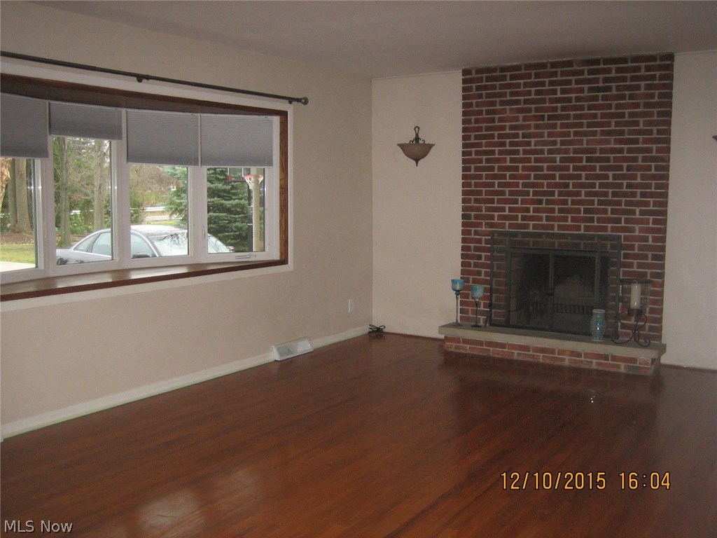 632 Miner Road Cleveland, OH 44143 - Photo 2 of 20 Spacious Living room with brick wall fireplace, and bay window