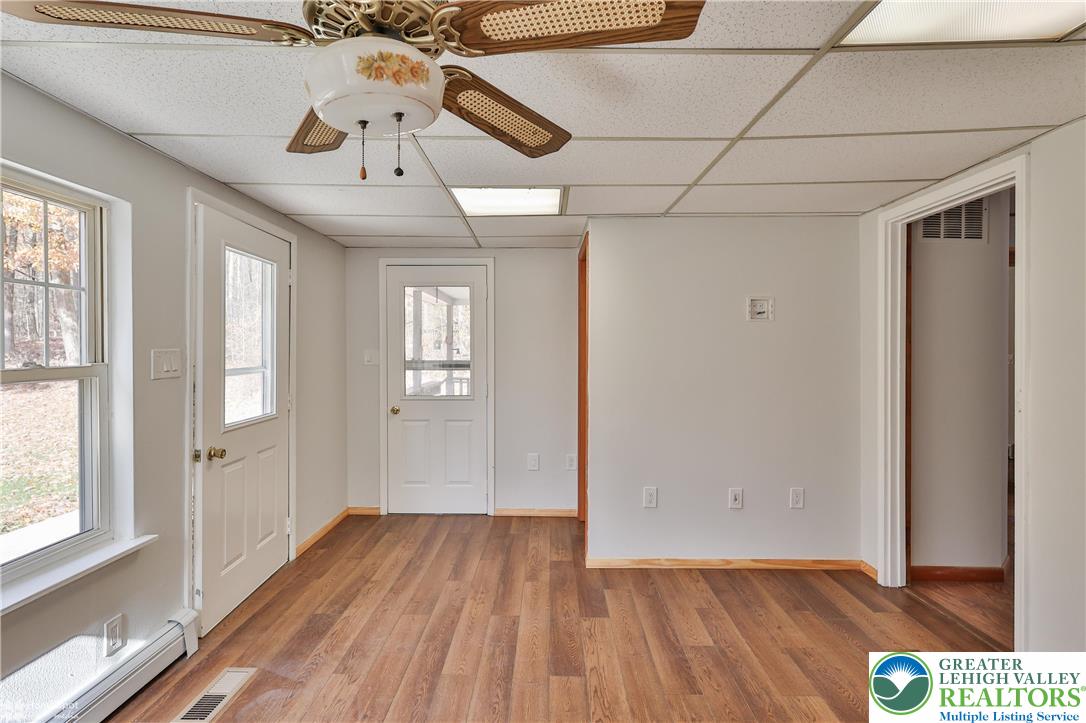 9160 Furnace Road Slatington, PA 18080 - Photo 35 of 52 a view of hallway with a large window and wooden floor