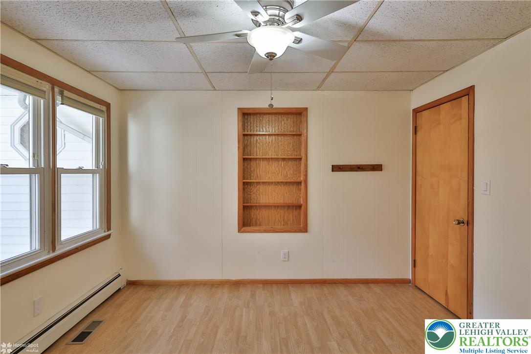 9160 Furnace Road Slatington, PA 18080 - Photo 41 of 52 an empty room with wooden floor cabinet and windows
