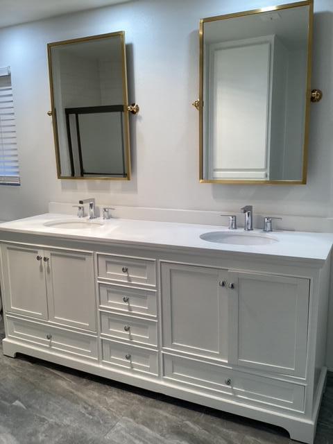 228 Eagle Lane Palmdale, CA 93551 - Photo 16 of 17 a bathroom with a sink vanity and mirror