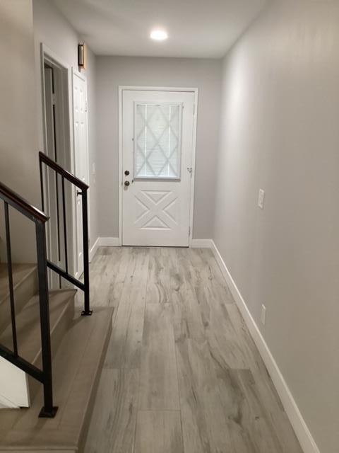 228 Eagle Lane Palmdale, CA 93551 - Photo 2 of 17 a view of empty room with wooden floor and fan