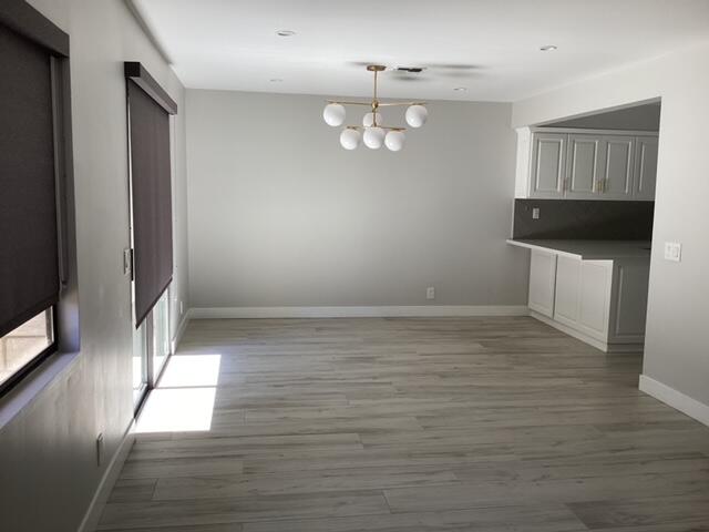 228 Eagle Lane Palmdale, CA 93551 - Photo 5 of 17 a view of empty room with wooden floor