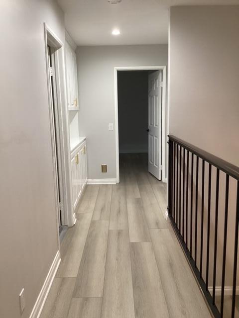 228 Eagle Lane Palmdale, CA 93551 - Photo 8 of 17 a view of a hallway with wooden floor