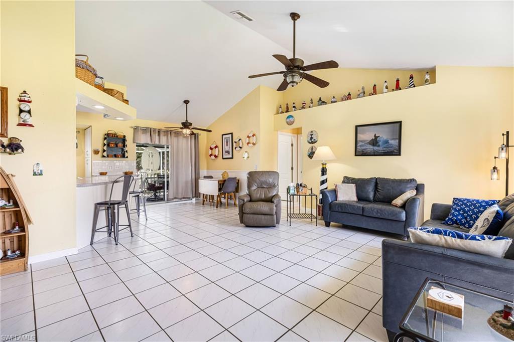 8241 Albatross Road Fort Myers, FL 33967 - Photo 11 of 48 a living room with furniture and a flat screen tv