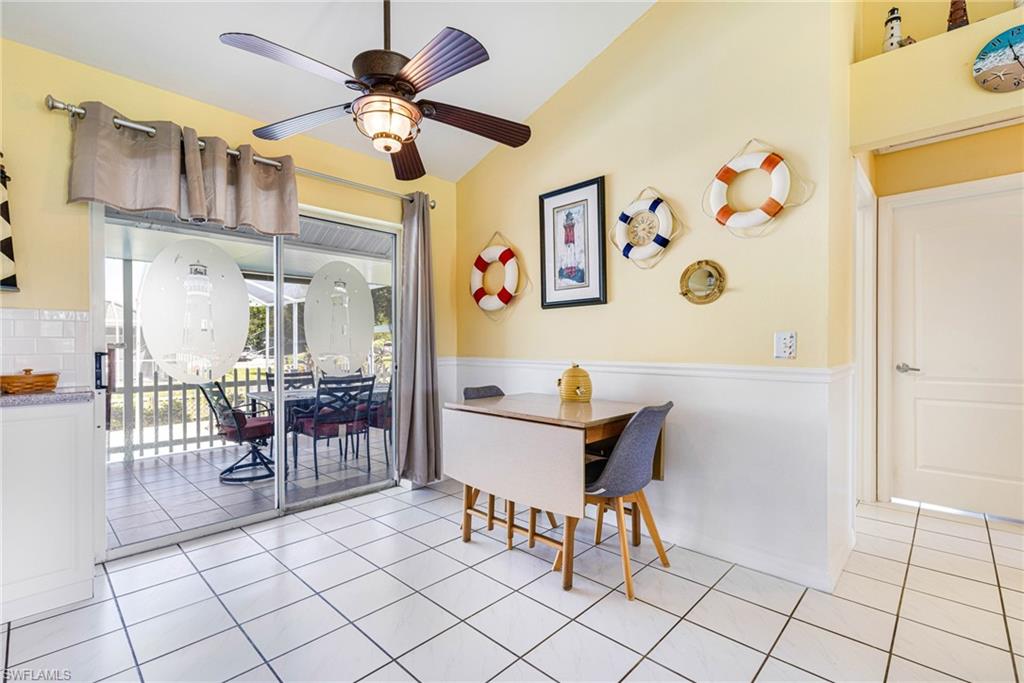 8241 Albatross Road Fort Myers, FL 33967 - Photo 14 of 48 a living room with a table and chairs
