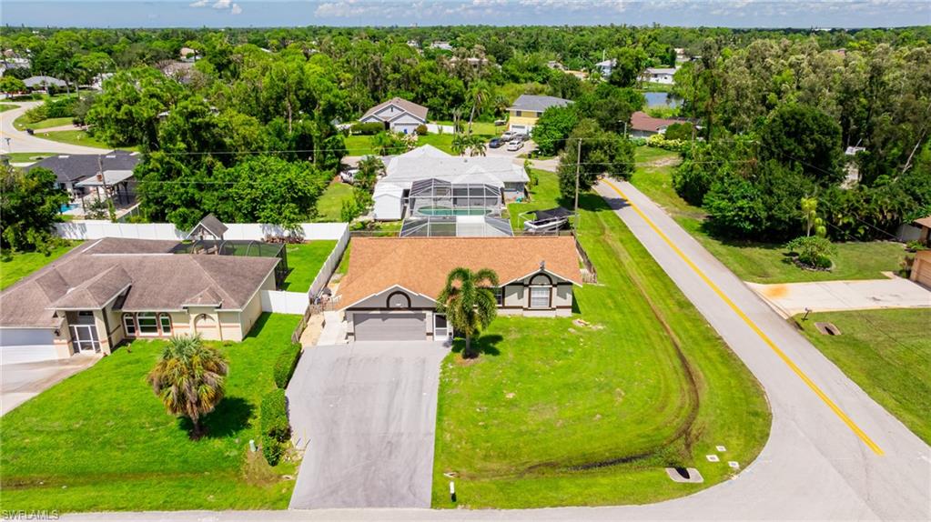 8241 Albatross Road Fort Myers, FL 33967 - Photo 36 of 48 a view of a swimming pool with a yard