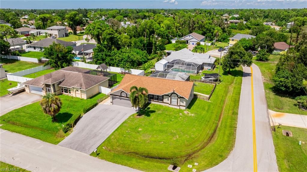 8241 Albatross Road Fort Myers, FL 33967 - Photo 38 of 48 an aerial view of a house with swimming pool outdoor seating and yard