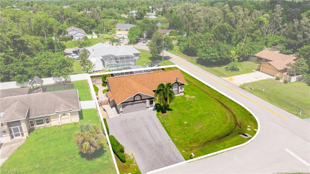 8241 Albatross Road Fort Myers, FL 33967 - Photo 39 of 48 a view of a swimming pool with a yard