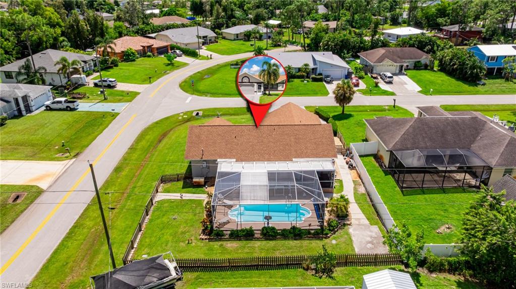 8241 Albatross Road Fort Myers, FL 33967 - Photo 4 of 48 an aerial view of a house with a big yard and large trees