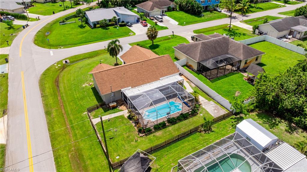 8241 Albatross Road Fort Myers, FL 33967 - Photo 47 of 48 an aerial view of a house with a garden and swimming pool