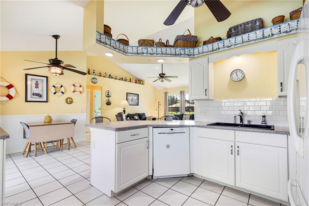 8241 Albatross Road Fort Myers, FL 33967 - Photo 5 of 48 a kitchen with a sink and cabinets