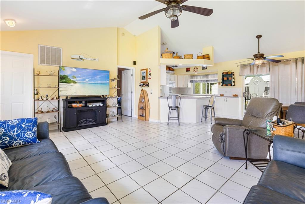 8241 Albatross Road Fort Myers, FL 33967 - Photo 10 of 48 a living room with furniture and a flat screen tv