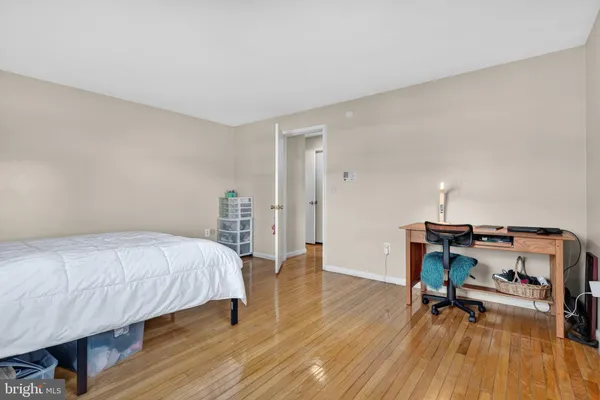 a bedroom with a bed and a table