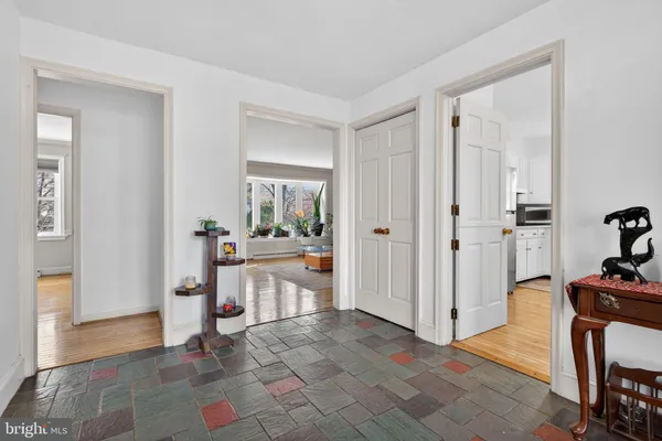 a view of a hallway with dining area