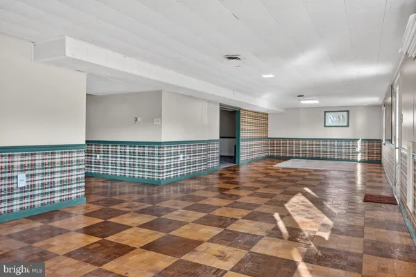 a view of a livingroom with wooden floor