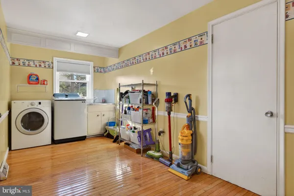 a view of a storage & utility room with washer and dryer