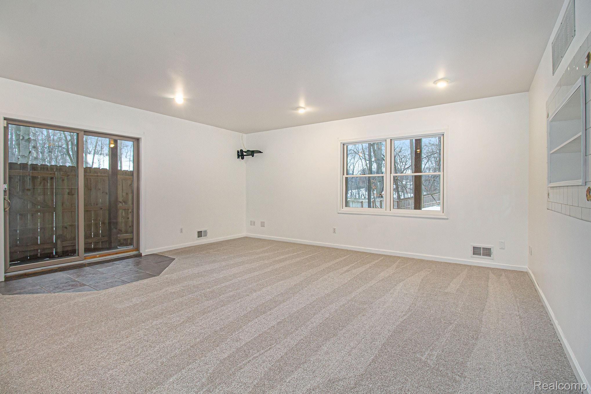2934 West Coon Lake Road Howell, MI 48843 - Photo 25 of 36 Basement - Walk out to fenced back yard.