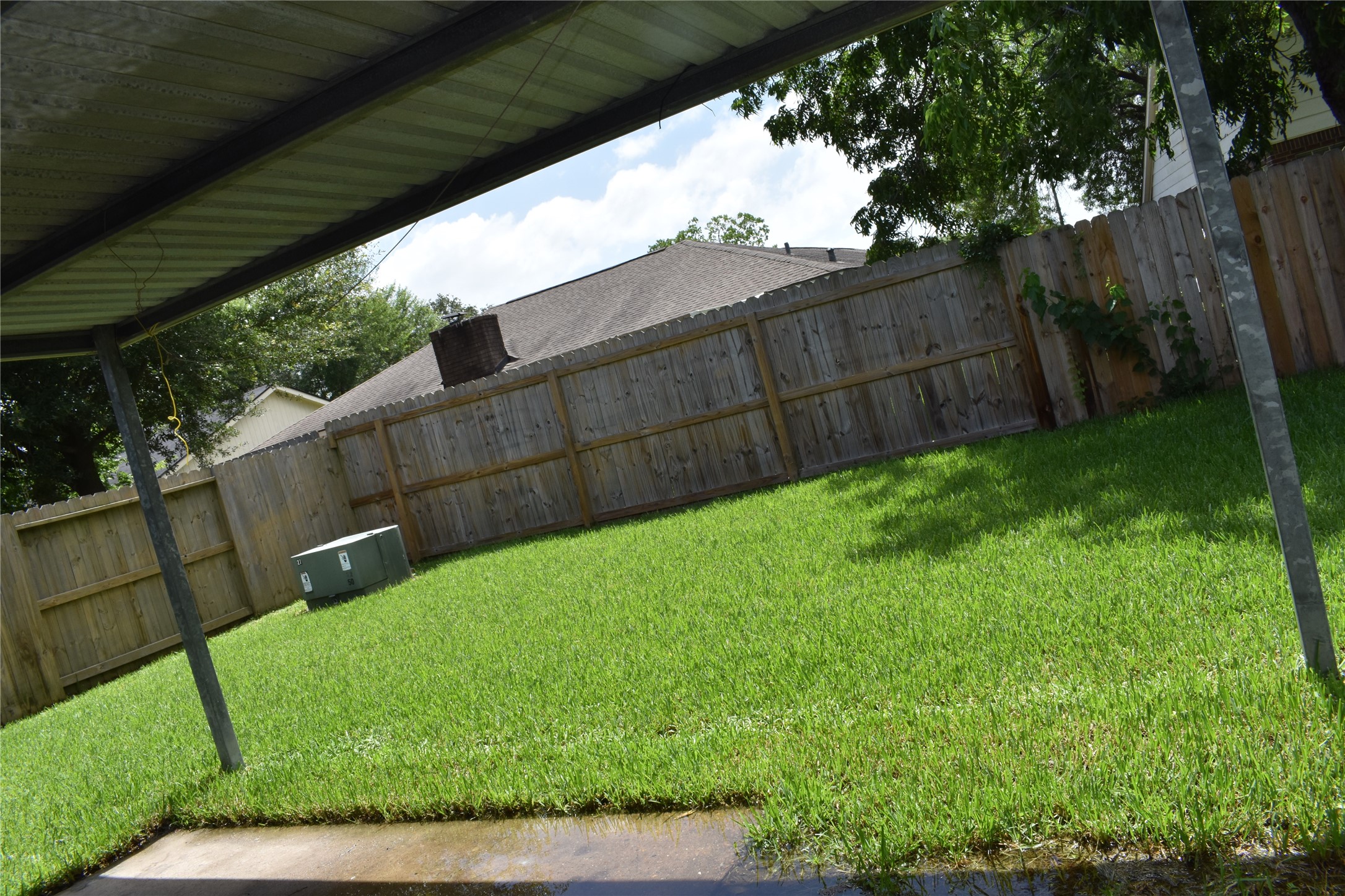 1347 Somercotes Lane Channelview, TX 77530 - Photo 25 of 30 a view of a backyard with a garden