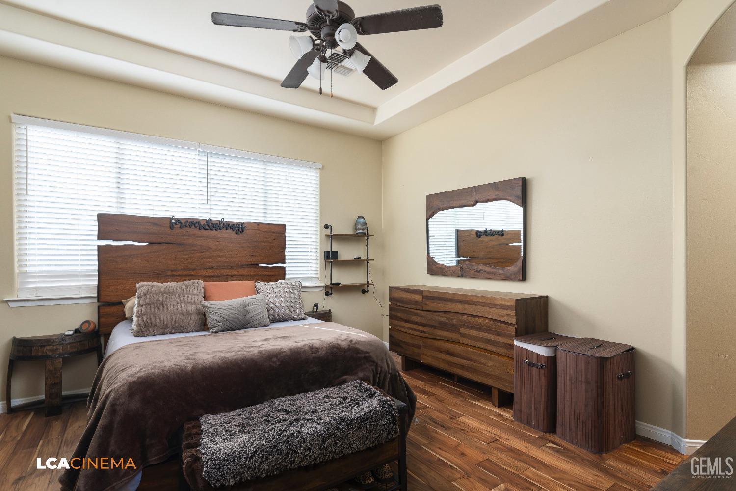 Undisclosed Address Shafter, CA 93263 - Photo 16 of 25 a bedroom with a bed and wooden floor