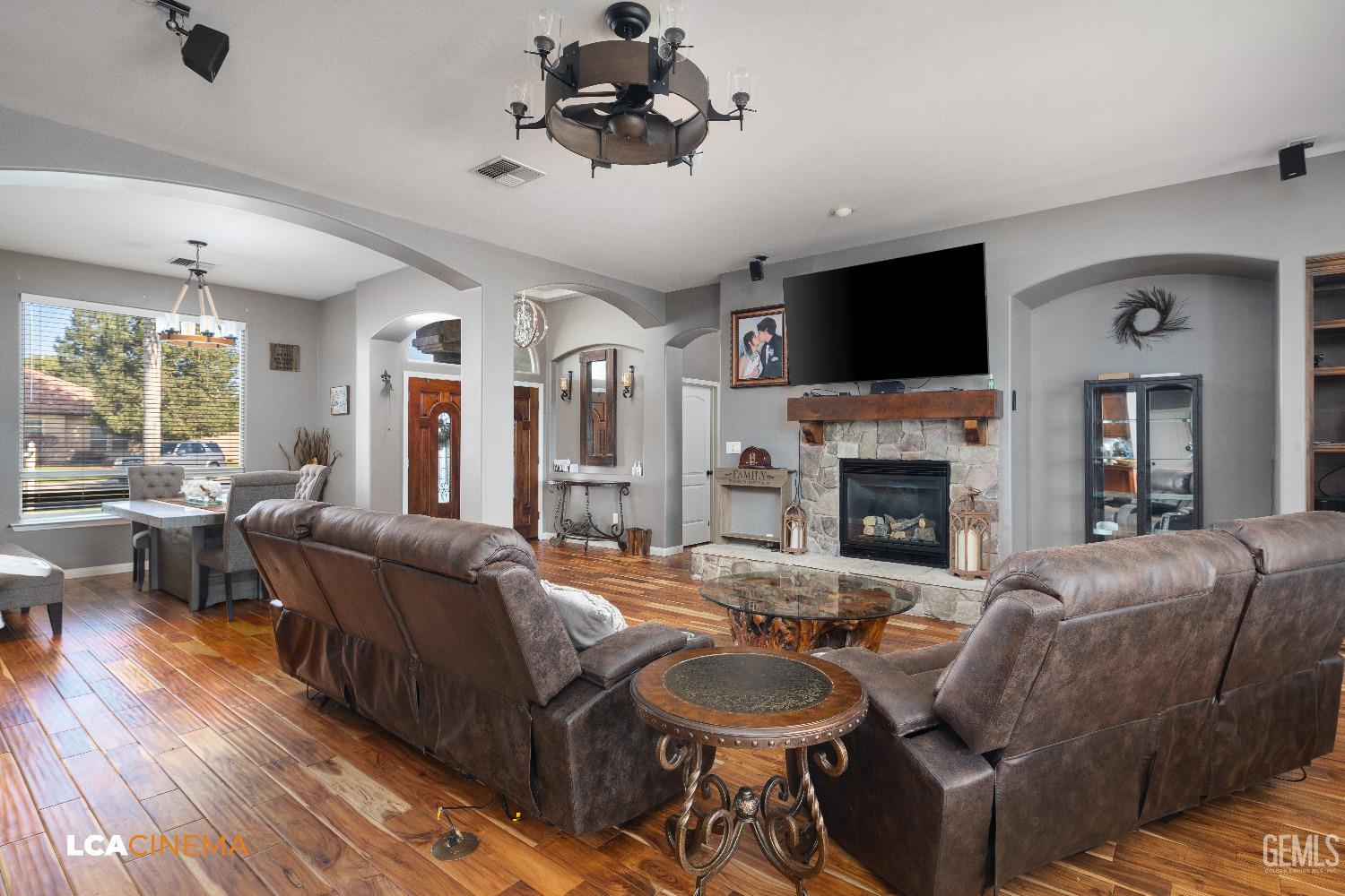 Undisclosed Address Shafter, CA 93263 - Photo 4 of 25 a living room with furniture a fireplace and a flat screen tv