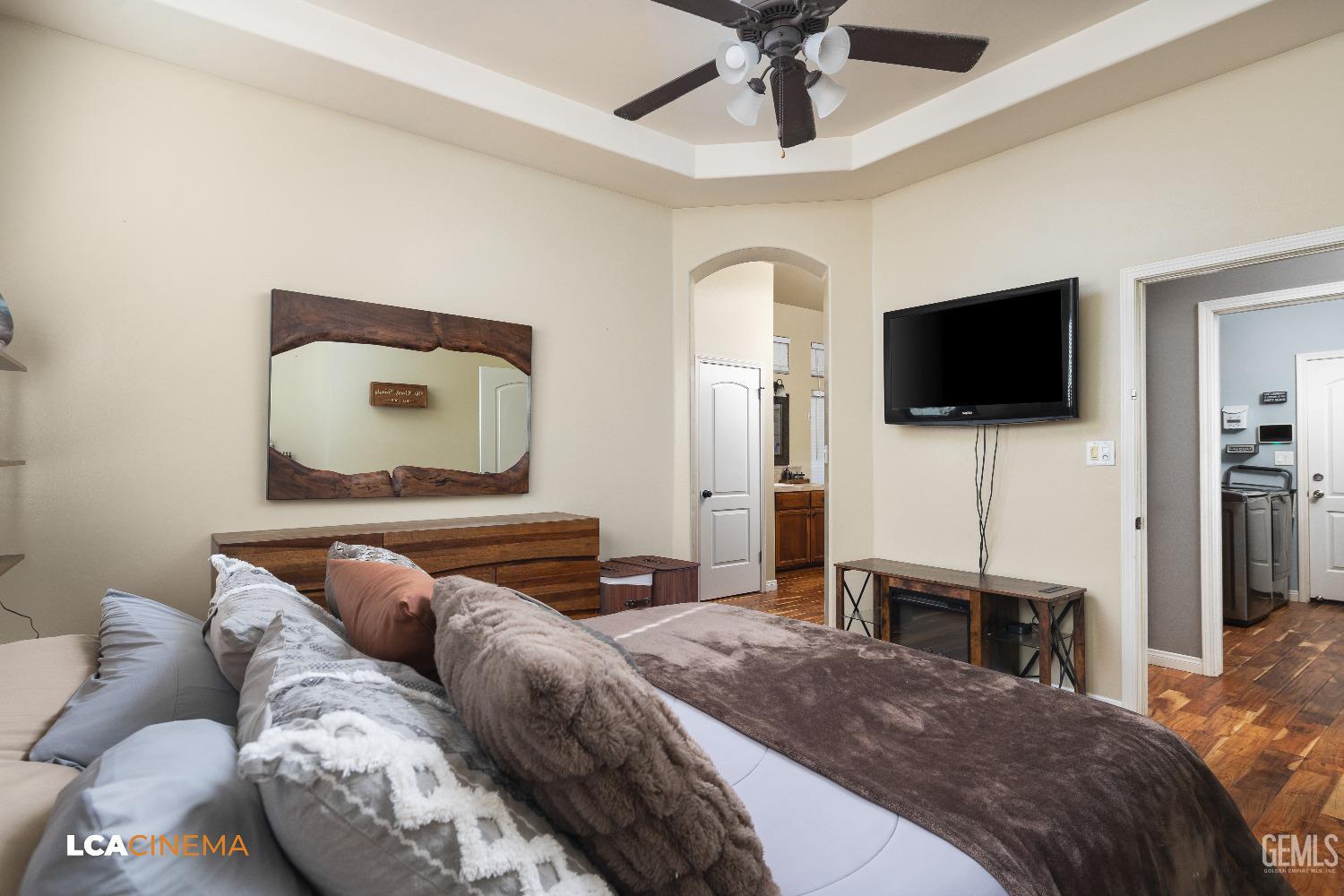 Undisclosed Address Shafter, CA 93263 - Photo 8 of 25 a bedroom with a bed and a flat screen tv