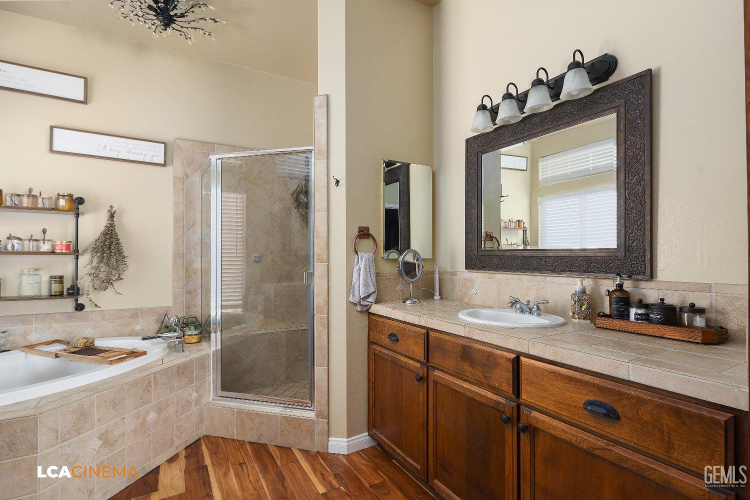 Undisclosed Address Shafter, CA 93263 - Photo 9 of 25 a bathroom with a sink and a mirror with bathtub
