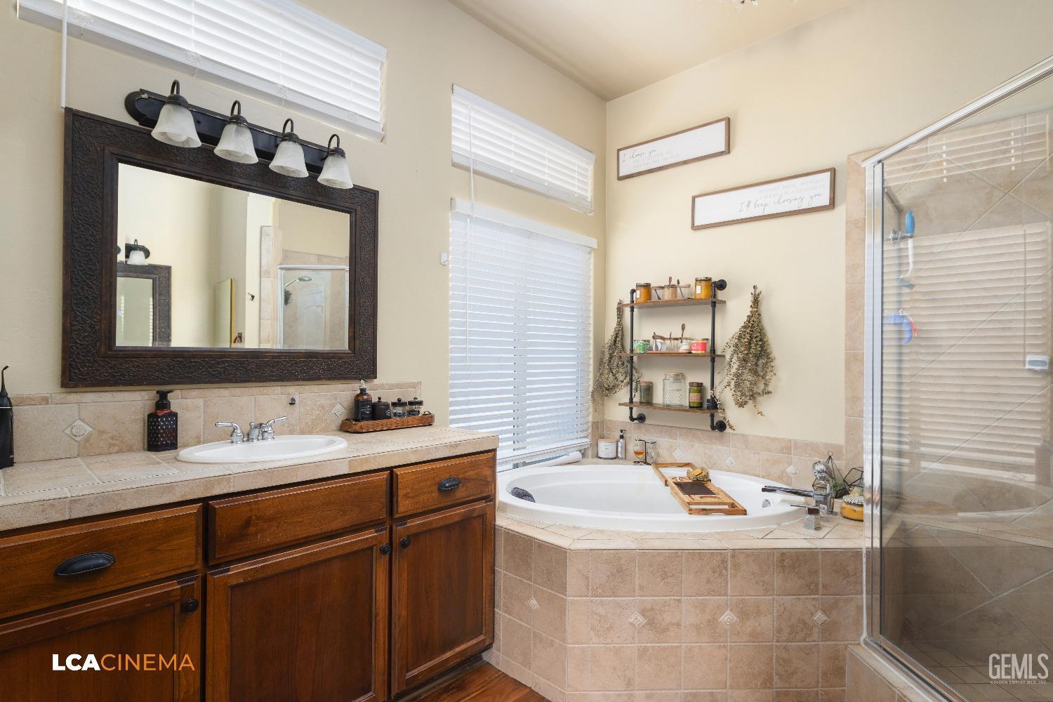 Undisclosed Address Shafter, CA 93263 - Photo 10 of 25 a bathroom with a sink and a mirror