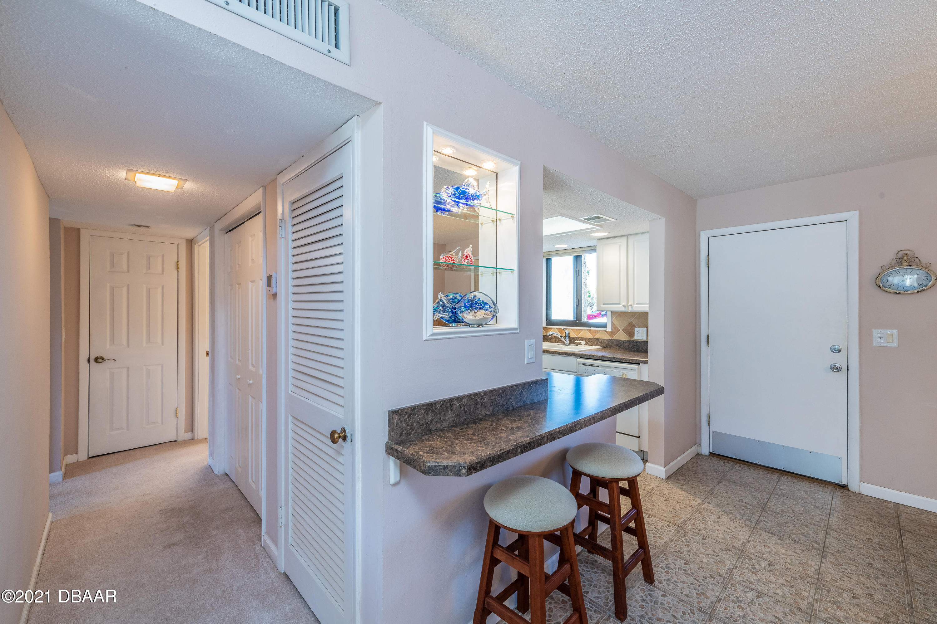 935 Ocean Shore Boulevard, Unit 110 Ormond Beach, FL 32176 - Photo 16 of 21 a view of a kitchen area