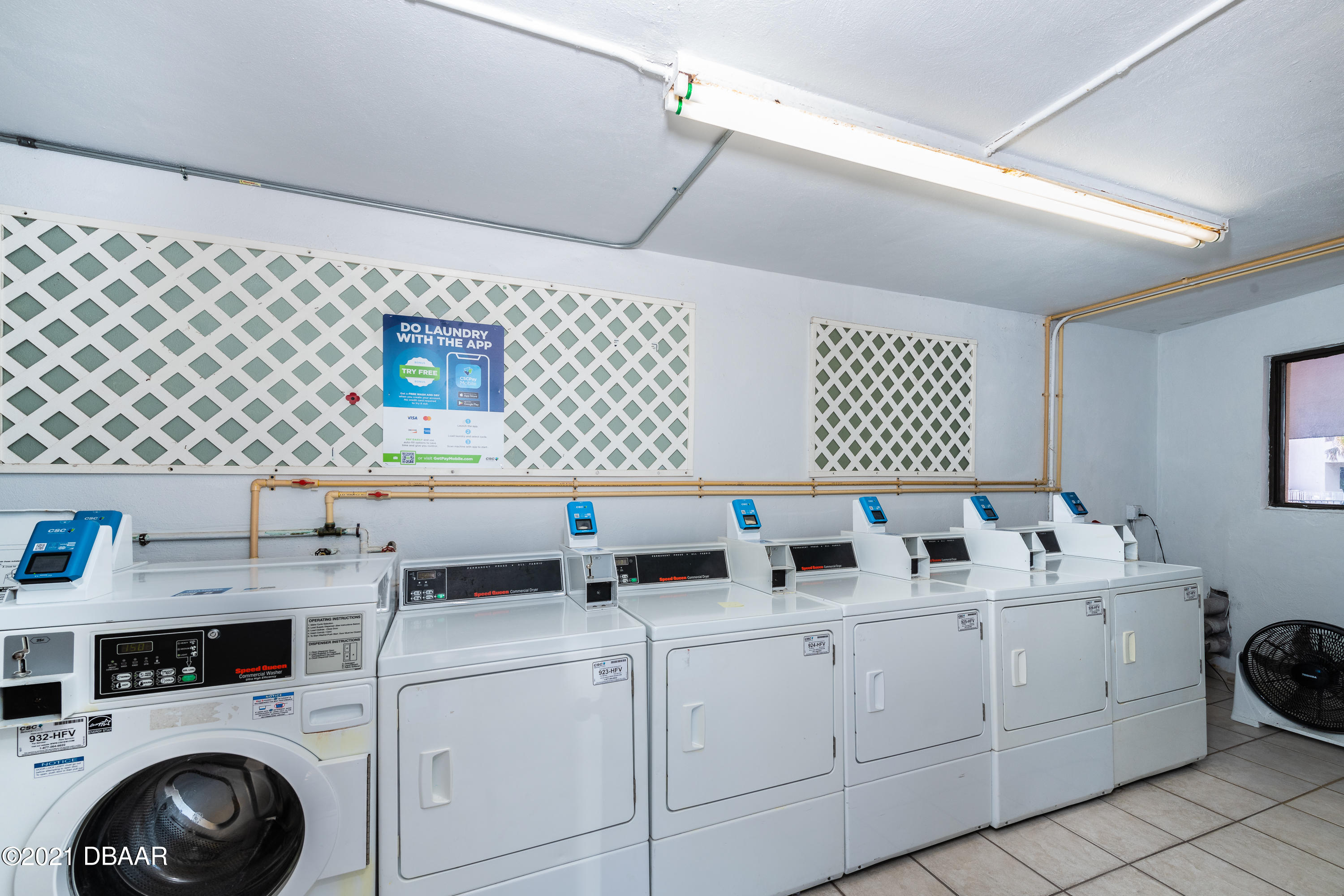 935 Ocean Shore Boulevard, Unit 110 Ormond Beach, FL 32176 - Photo 21 of 21 a utility room with dryer and washer