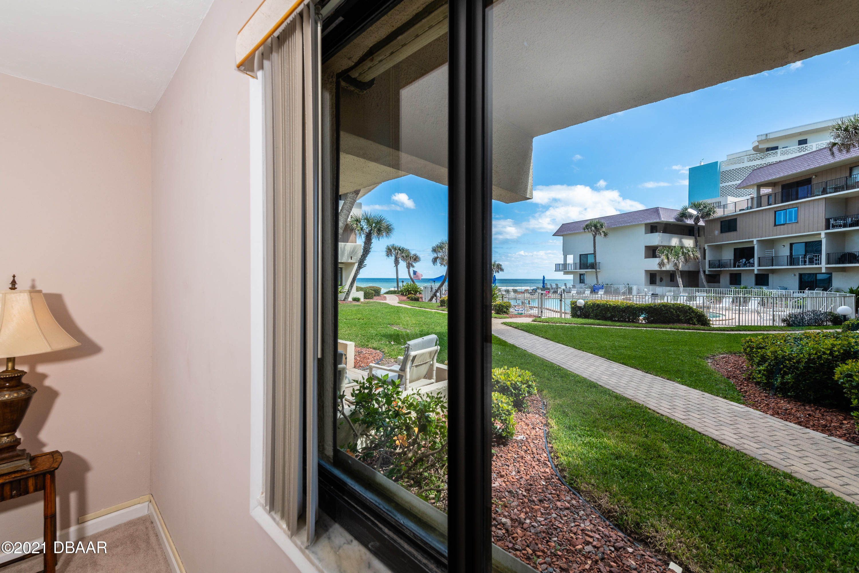935 Ocean Shore Boulevard, Unit 110 Ormond Beach, FL 32176 - Photo 9 of 21 a view of building from the background