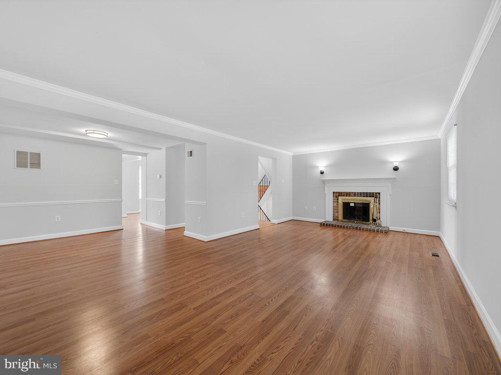 3827 Gawayne Terrace Silver Spring, MD 20906 - Photo 15 of 45 a view of empty room with wooden floor and fireplace