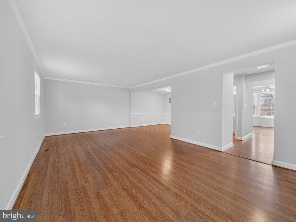 3827 Gawayne Terrace Silver Spring, MD 20906 - Photo 16 of 45 an empty room with wooden floor and windows