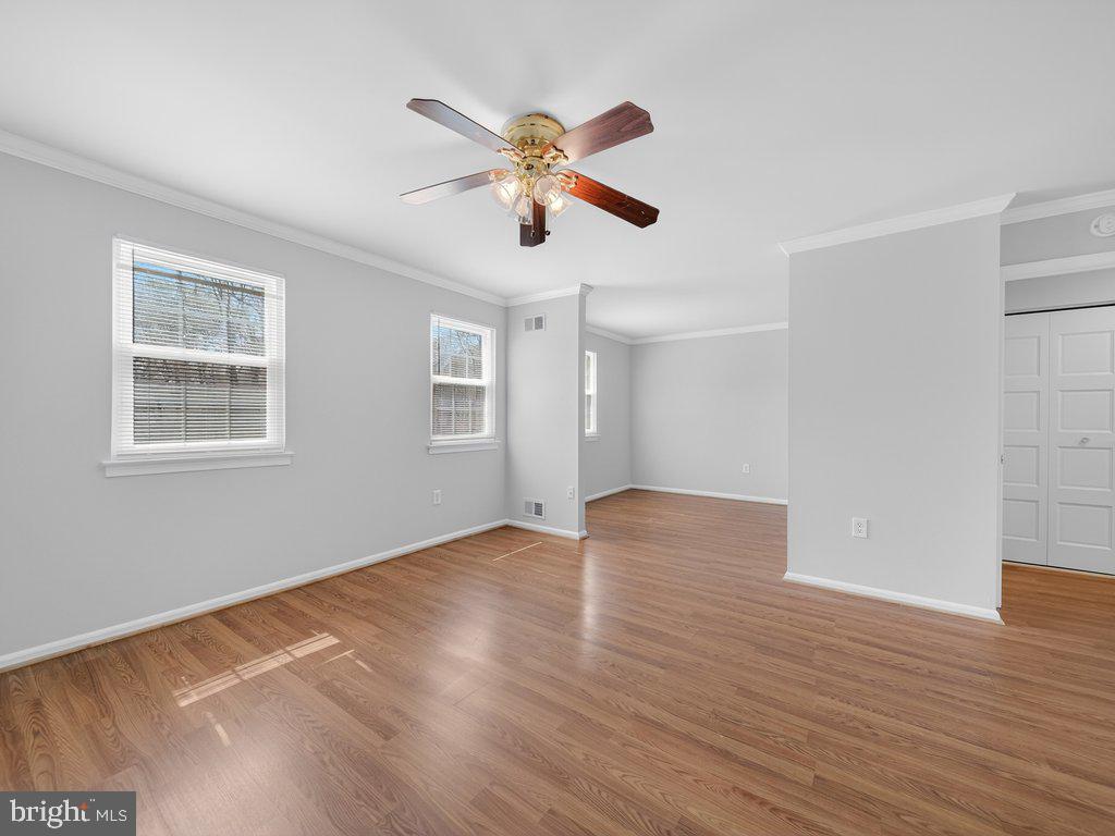3827 Gawayne Terrace Silver Spring, MD 20906 - Photo 20 of 45 a view of an empty room with wooden floor and a window