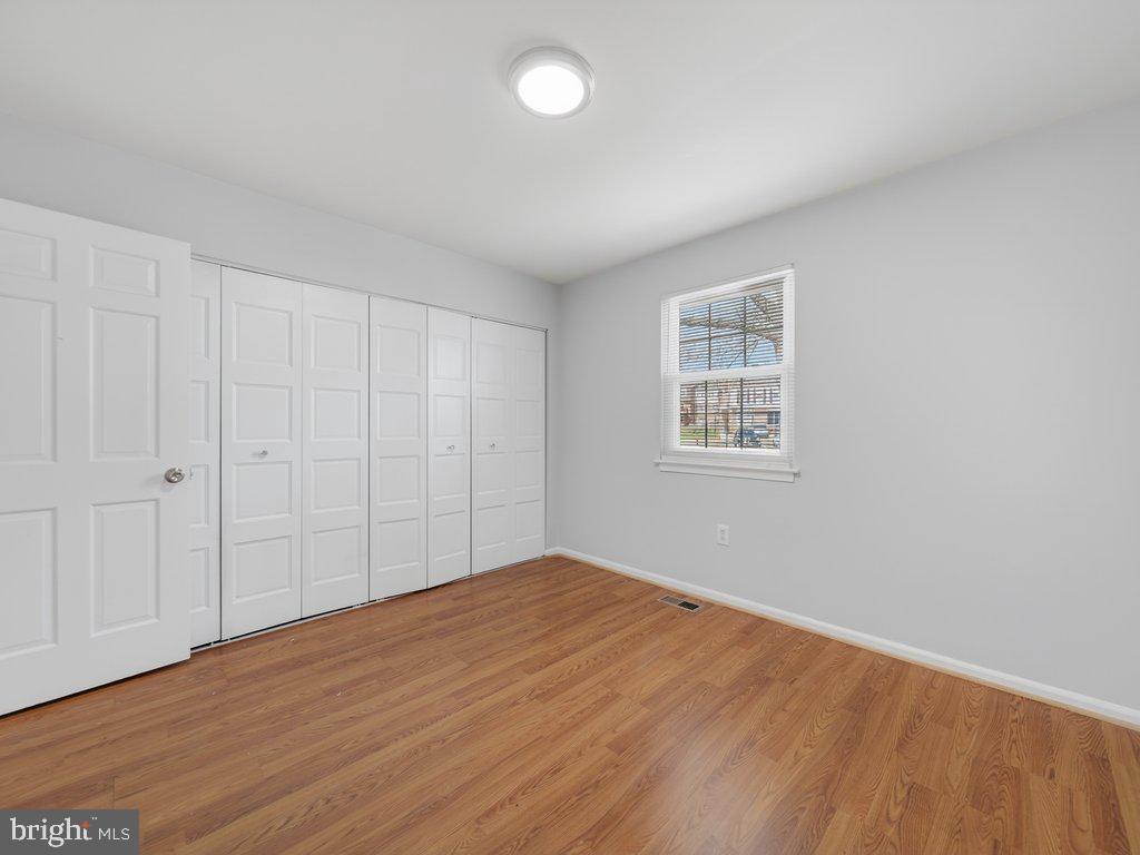 3827 Gawayne Terrace Silver Spring, MD 20906 - Photo 32 of 45 a view of empty room with wooden floor and fan