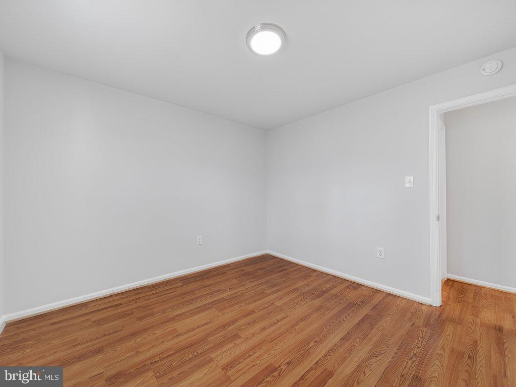 3827 Gawayne Terrace Silver Spring, MD 20906 - Photo 33 of 45 a view of empty room with wooden floor