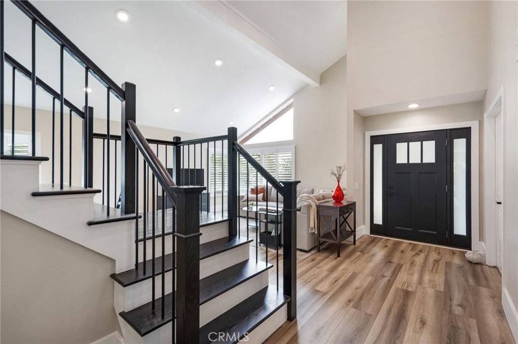 109 Cinnamon Ridge Road Brea, CA 92821 - Photo 9 of 67 Main front entrance, vaulted ceilings, LVP flooring, new stairs (treads and banister).