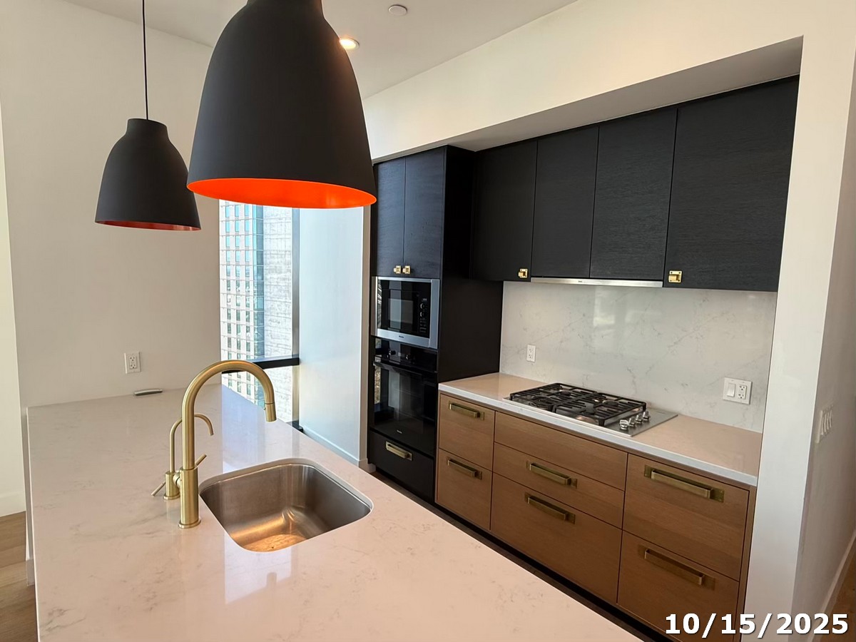 70 Rainey Street, Unit 2907 Austin, TX 78701 - Photo 2 of 15 a kitchen with a stove and a sink