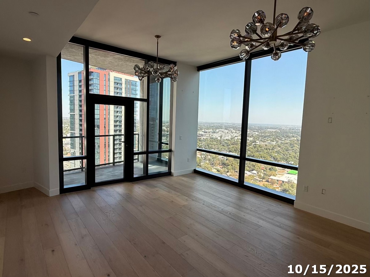 70 Rainey Street, Unit 2907 Austin, TX 78701 - Photo 4 of 15 a view of an empty room with window wooden floor