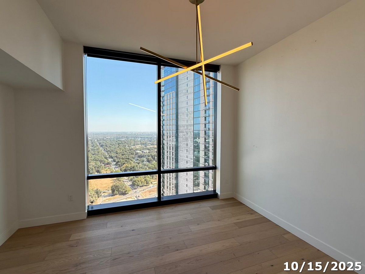 70 Rainey Street, Unit 2907 Austin, TX 78701 - Photo 7 of 15 a view of a glass door and wooden floor