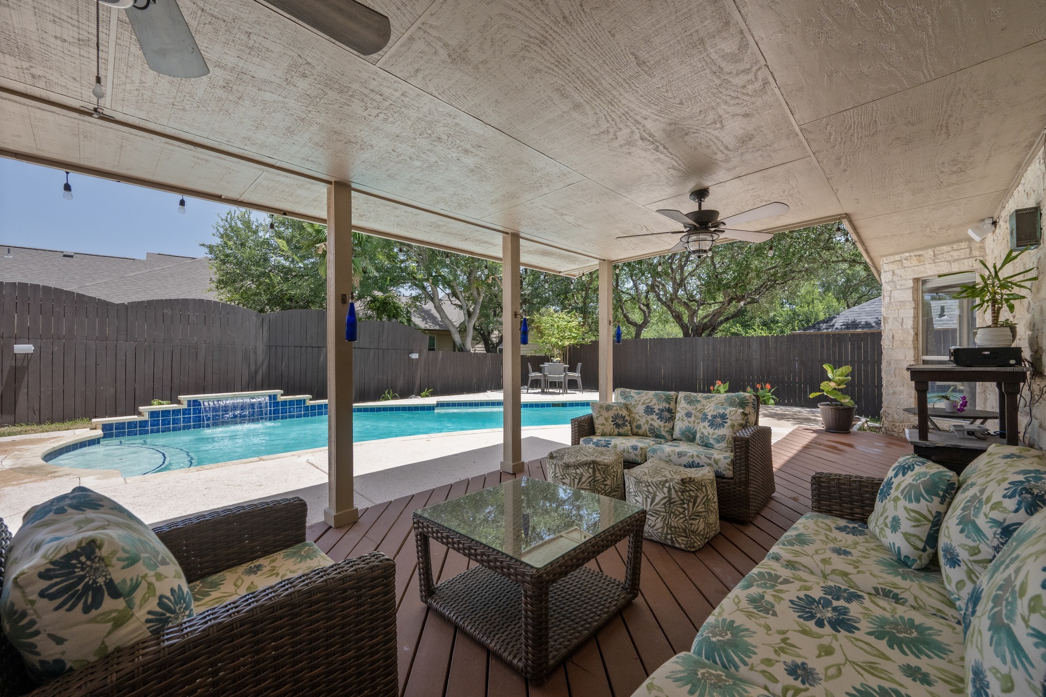 108 Thornwood Road Georgetown, TX 78628 - Photo 35 of 40 An inviting outdoor living space features a covered patio and a shimmering in-ground pool, perfect for entertaining.
